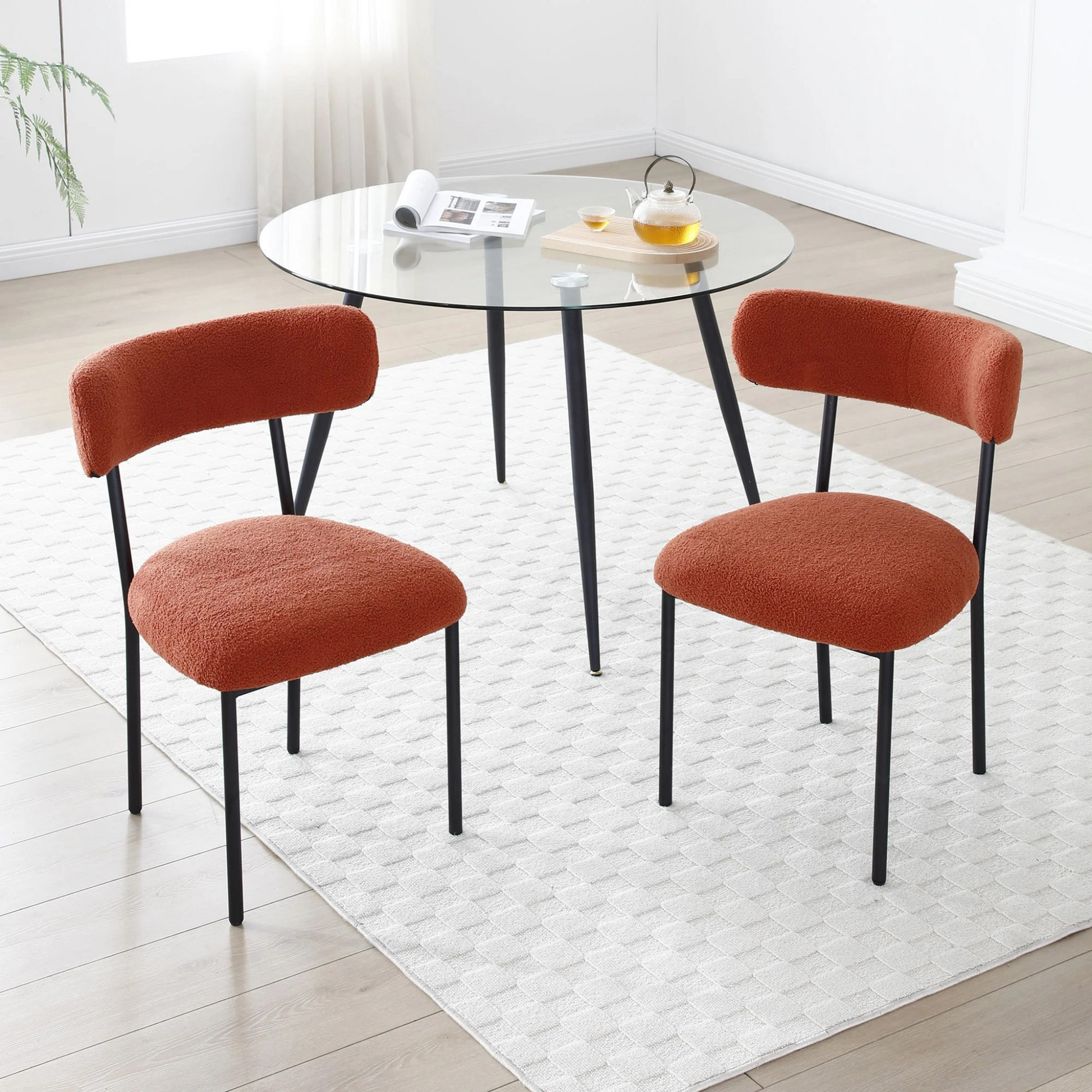 Set of 2 Mid-century modern orange sherpa chairs | curved backrest round seating & black metal legs
