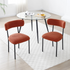 Set of 2 Mid-century modern orange sherpa chairs | curved backrest round seating & black metal legs